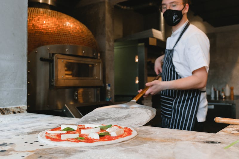 Anthony's coal fired pizza kitchen team at work